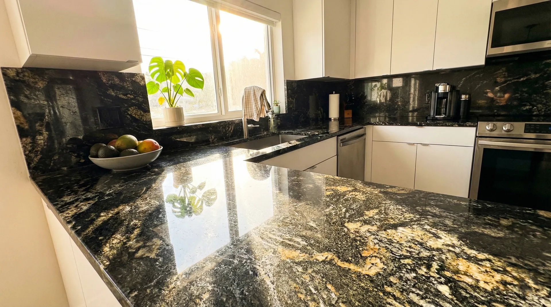 Contemporary kitchen with polished black granite countertops and gold veining installed in Fort Lauderdale by Appo Designs